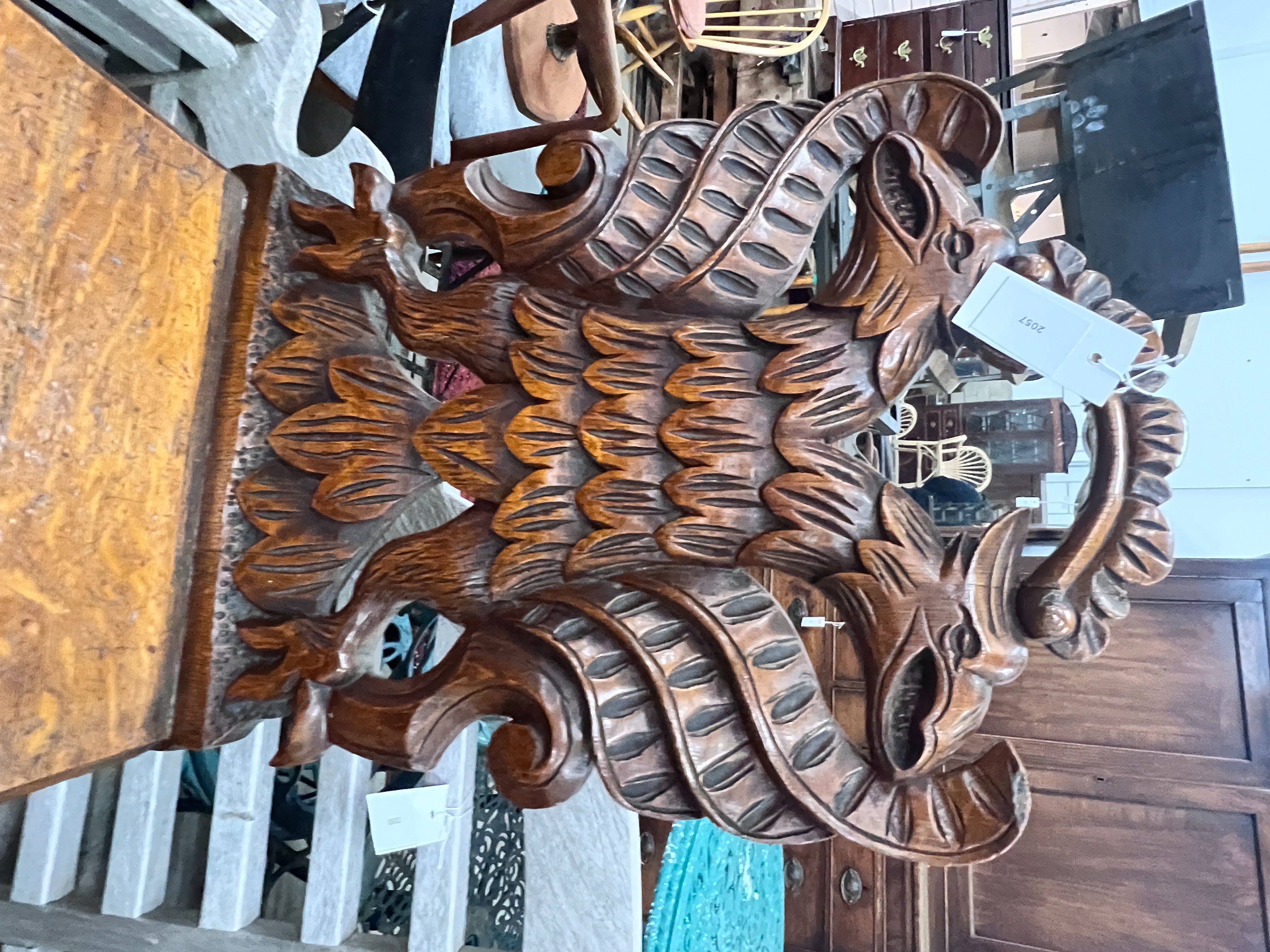 A pair of Victorian carved oak hall chairs with carved twin eagle backs, width 44cm, depth 40cm, height 90cm